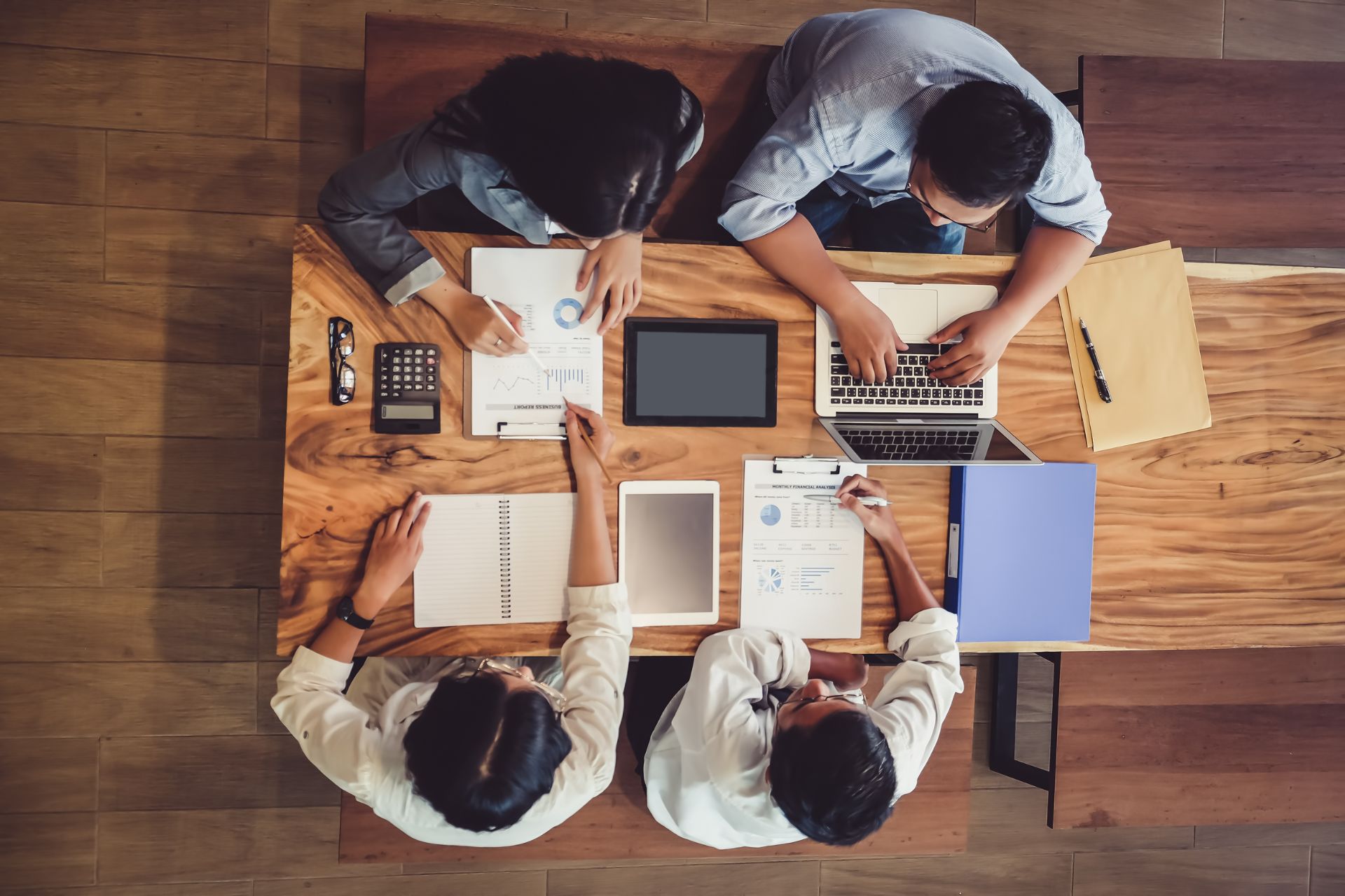 Overhead Shot of Marketing Team Collaborating Together