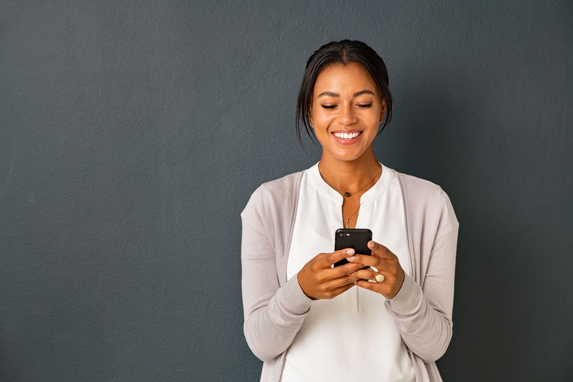 Happy Woman Using Mobile Device